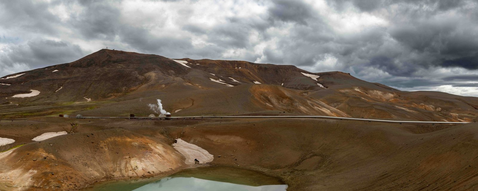 a mountain with a lake in the middle of it